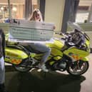 A member of Northumbria Blood Bikes visited The Trap Inn to collect the money raised on a bike called The Bebby.