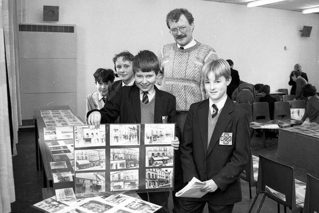 Pupils at Lindisfarne Middle School in Alnwick looking at photographs of old scenes of the town that had been lent to them by Adrian Ions.