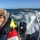 Hilary Brooker-Carey pilots the boat to Coquet Island