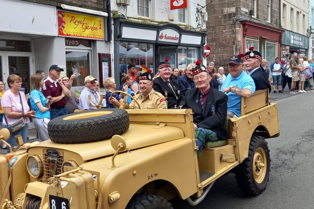 A vintage army vehicle took some veterans on the route.