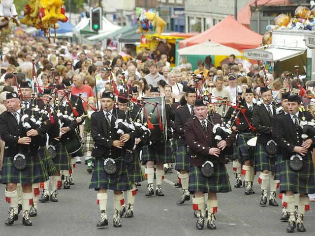 Pipe band winds its way through the town centre.
