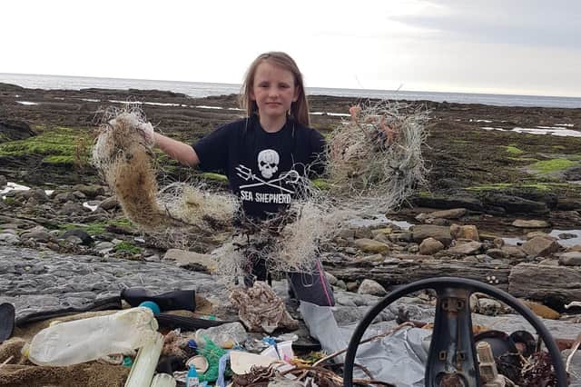 Madison Young with some of the rubbish she collected.