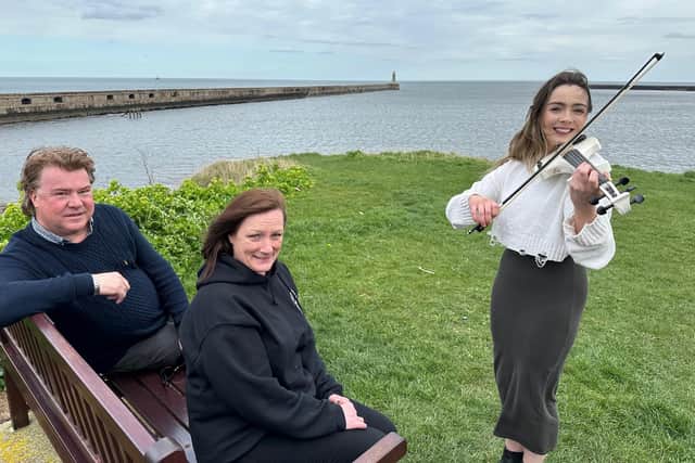 Sunday for Sammy trustees Paul Irwin and Lynn O’Sullivan with Charlotte Kennedy and her electric violin. Picture: Highlights PR
