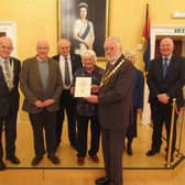 EBDA Trustee and Mayor of Berwick, Coun Mike Greener, presents the EBDA Award to Marion Lauder of the shop committee, with left to right, Coun Trevor Cessford, Civic Head
of Northumberland County Council, Richard Copland (shop committee), Captain James Evans, EBDA Chairman, Mrs Jeanna Swan, Lord Lieutenant of Berwickshire, and Coun
Watson McAteer, Convener of Scottish Borders Council.
