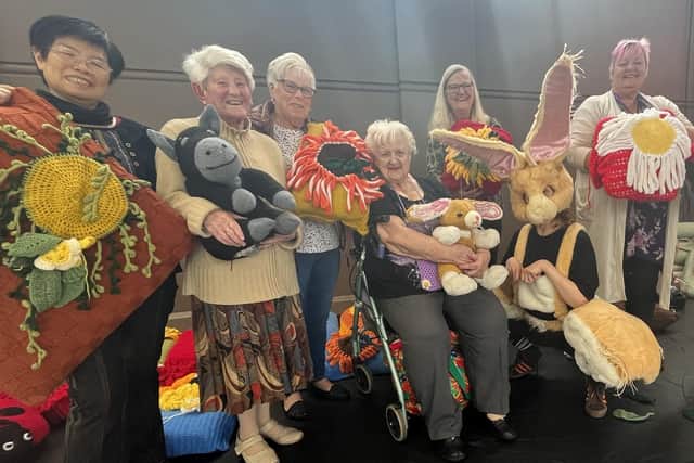 The balletLORENT Knitters, Movers and Shakers ladies with some of their designs and The Velveteen Rabbit.