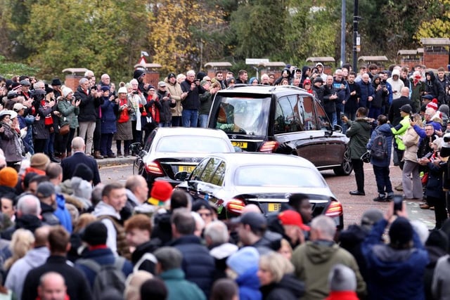 The funeral procession for Sir Bobby Charlton passes Old Trafford. (Photo by Michael Steele/Getty Images)
