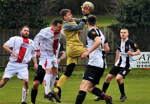 Alnwick keeper Thomas Slack in the thick of the action against Shankhouse. Picture by Steve Miller.