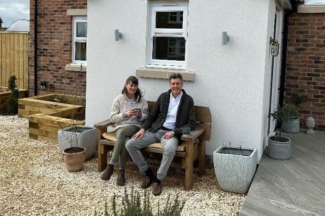 Susanne James and her husband John outside their property at the Priest Moor development in Christon Bank.
