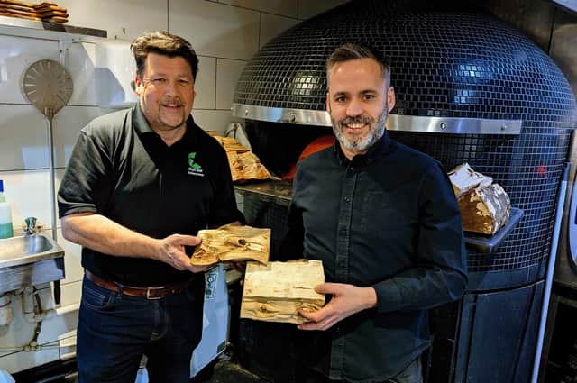 Neil Hedley, manager at The Woodfuel Centre (left) with Porky's manager Armando Fernandes. (Photo by Blyth Star Enterpises)