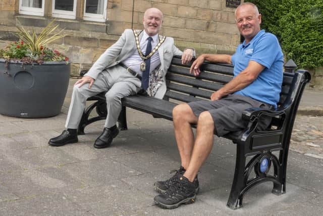 Mayor Geoff Watson and Cllr Peter Broom on one of the new benches in Alnwick. Picture: Alnwick Town Council