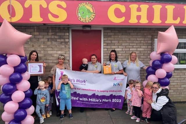Staff and children at Dinotots Childcare celebrate being recognised with a Millie's Mark. (Photo by Dinotots)