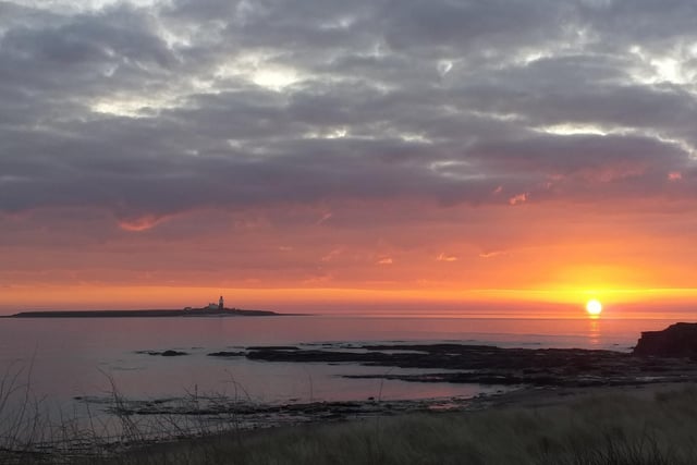 Sunrise over Coquet Island taken by Brendan Doherty from Amble links.