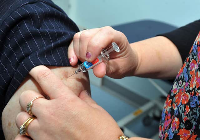 File picture of a flu vaccine being administered in previous years.