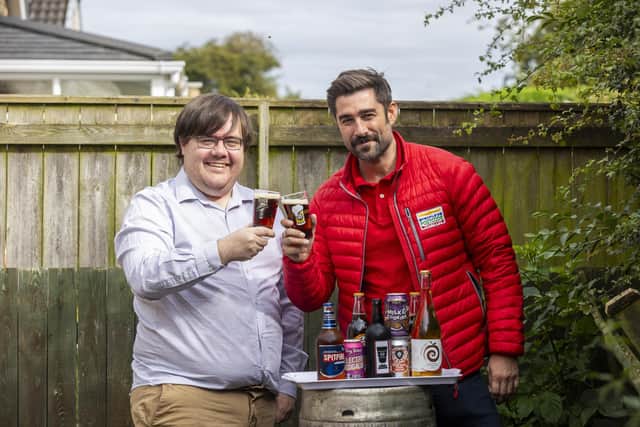 Councillor and Newcastle Beer and Cider Festival organiser Anthony McMullen toasts his Postcode Lottery winnings. (Photo by People's Postcode Lottery)