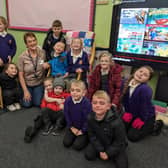 Jane Sampson, community reading worker with pupils from Grace Darling C of E Primary School’s Story Club.