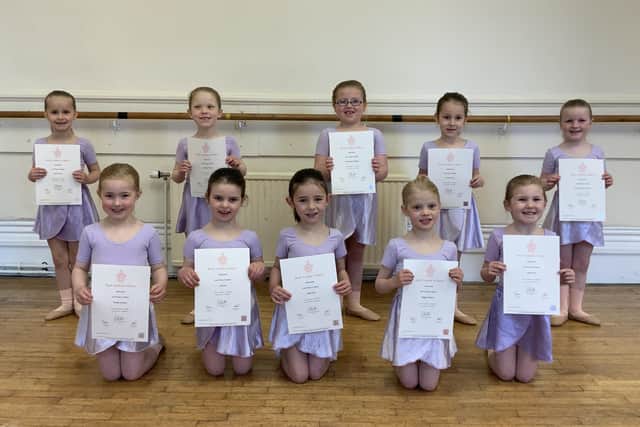 Pupils with their ballet exam certificates.