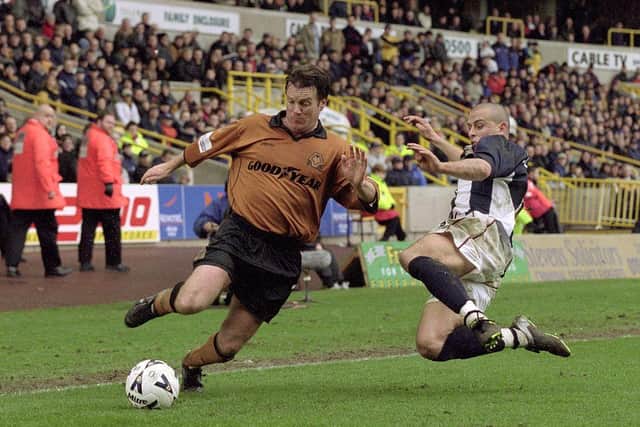 Andy Sinton of Wolverhampton Wanderers takes the ball past Neil Clement of West Bromwich Albion in 2001.