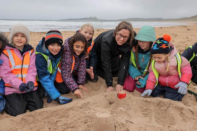 The Right Reverend Dr Helen-Ann Hartley, who is to become the next Bishop of Newcastle, with schoolchildren from Embleton Primary School on Embleton beach.