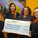 The Hays Travel Morpeth team with the cheque to present to Barnabas Safe & Sound.