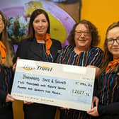 The Hays Travel Morpeth team with the cheque to present to Barnabas Safe & Sound.