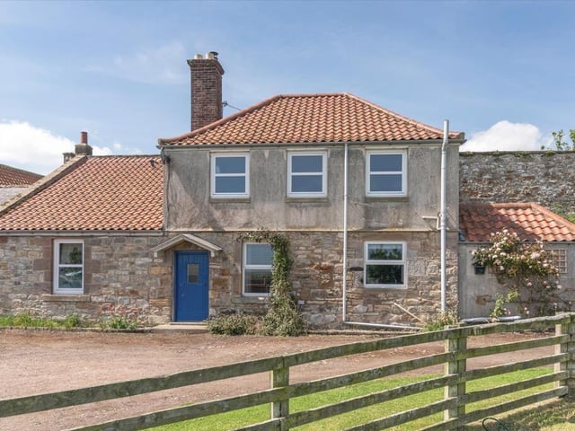 A separate two-bedroom cottage offers additional living accomodation.