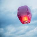 Lantern flies up highly in the sky.