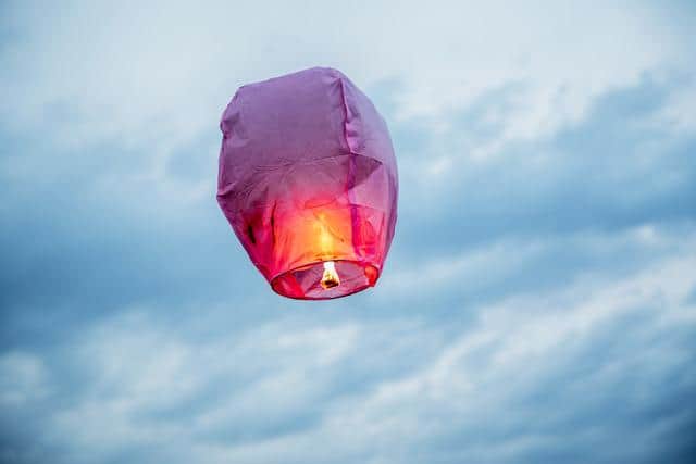 Lantern flies up highly in the sky.
