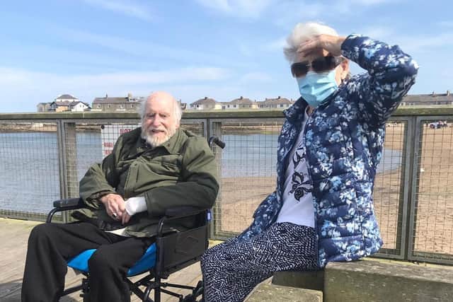 Eric and Betty Fender enjoying the sun on Amble Pier.