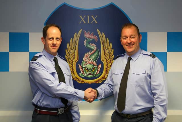 Wing Commander Misiak handed over the pennant to Wing Commander Crow at the Control and Reporting Centre. Picture: Simon Moore