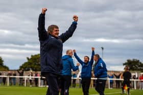 Ian Skinner and his copaching staff celebrate at the final whistle. Picture by Rachel McDonald.