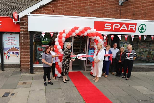 The ribbon is cut on the newly-refurbished SPAR, which now contains a Post Office branch. (Photo by Post Office)