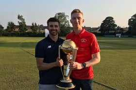 Cal Storey (pictured right ) with England’s Ashington-born cricketer Mark Wood holding the World Cup.