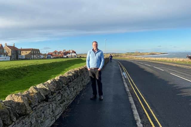 Cllr Guy Renner-Thompson on the resurfaced St Aidan's footpath in Seahouses.