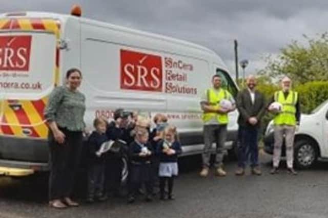 From left, Jill O’Dell (Joint Acting Headteacher), a group of Tritlington pupils and SinCera Retail Solutions representatives - Ali Arif (Project Manager), Martyn Lee (Managing Director), Simon Smith (Operations Director).