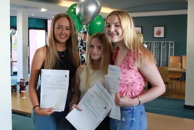 Ellie Morris, Ella Crozier, and Anya Aisbitt with their A-Level results at Bede Academy.