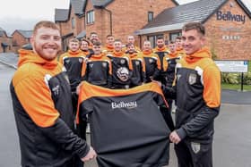 The Blyth Rangers first team outside Bellway’s Woodgreen development, with Captain Dan Burge and player Kieran Swann showing off their new, Bellway sponsored hoodies.