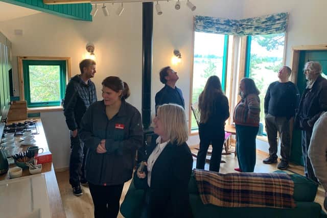Guests take a tour of the new treehouse at Laverock Law.