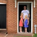 John Nelson and his two daughters on moving day.