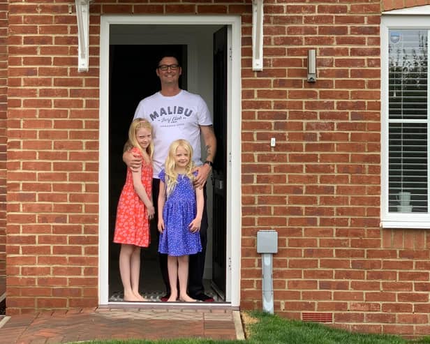 John Nelson and his two daughters on moving day.