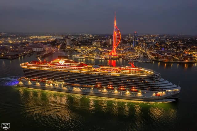 Virgin Voyages' Scarlet Lady passes the Spinnaker Tower which was lit up red last night for the occasion
Picture: Dave Aird