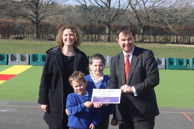 Alexandra Palmer and Guy Opperman with two Stannington First School pupils.