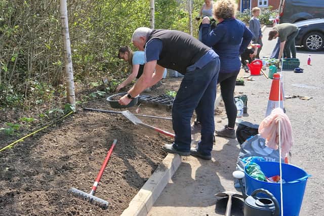 Volunteers hard at work on last year's award-winning community garden.