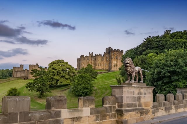 Alnwick Castle, which was used as Hogwarts in the first two Harry Potter films, pictured from the Lion Bridge.