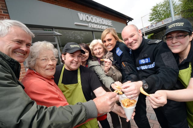 From left, Coun. David Smith, Betty Hill, Philip Michael, Jeanette Samways, Sheila Frankland, PCSO Stevie Willetts, PC Ian Dickson and Anna Michael got ready to serve up supper at the Harold Harvey Hall in 2013