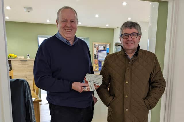 Brian Wood of Berwick receives his second prize of £100 of vouchers from Berwick Chamber of Trade chairman Stephen Scott.