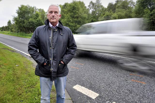 Council leader Glen Sanderson by the A697.