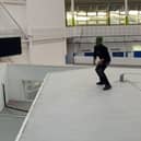 A TikTok video showing a masked youth inside the building.
