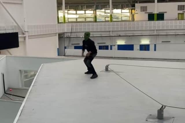 A TikTok video showing a masked youth inside the building.