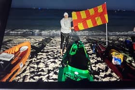 Chris Ormston with the Northumberland flag in Perth, Australia.