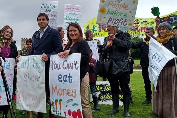 Isleworth councillors Salman Shaheen And Sue Sampson protest against the Duke of Northumberland's plans to build housing on the Park Road Allotments in London outside the Duke's London residence, Syon House